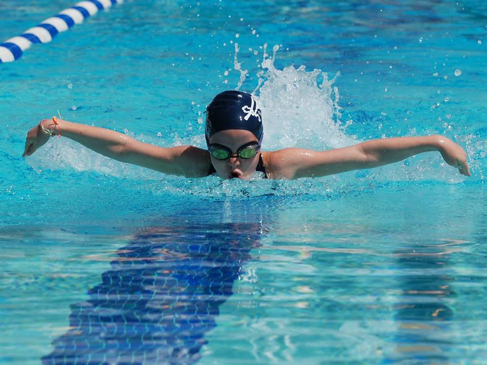 Girl-swimming-butterfly-stroke-pool-competition-Vesper-Country-Club
